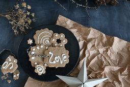 Gluten-free shortbread biscuits decorated with icing and the word 'Love'