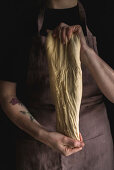 Challah bread (Jewish cuisine) being made: yeast dough being kneaded