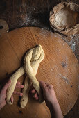 Challah bread (Jewish cuisine) being made: dough being plaited