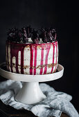 Hibiscus and mascarpone layer cake on a cake stand