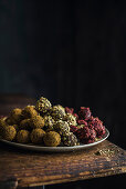 Homemade sea buckthorn, pistachio and cherry truffles