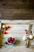 Festive raspberries on a wooden baking surface
