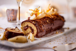 Yule log with pears and caramel for Christmas