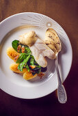 Turbot with truffle sauce, potatoes and spinach