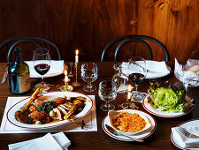 Chicken fricassée, kimchi gratin and red butter lettuce with caper and anchovy vinaigrette