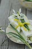 A place setting with snowdrops
