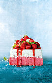 Strawberry and basil ice-cream cake with meringue and pink peppercorns