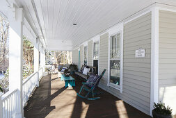 Rocking chair and other seating on American-style veranda