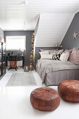 Cosy, Bohemian-style attic room with grey walls