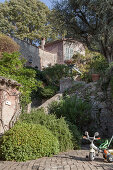 Courtyard and stone steps leading to Mediterranean house