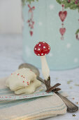 Peppernuts and a toadstool-shaped vintage Christmas tree decoration