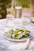 Summery zucchini and pea salad with pine nuts