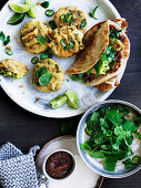 Spiced potato and pea fritters with sweet and sour chutney