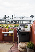 Barbecue on balcony with view of neighbouring houses