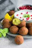 Falafel with mint yoghurt and pomegranate seeds (Arabia)