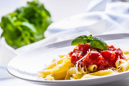 Penne with tomato sauce and basil