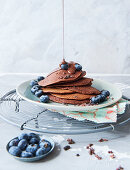 Sugar-free vegan chocolate pancakes with blueberries