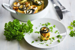 Grilled zucchini rolls with vegan almond cream and fresh parsley