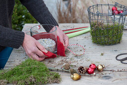 Candle arrangement in a wire basket as Advent wreath