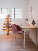 Desk, shell chair and DIY Christmas tree made from reclaimed wooden boards