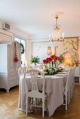 Festively set table in dining room in antique Swedish style