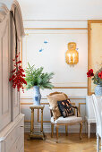 Antique furniture in festive dining room with panelled walls