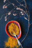 Ground turmeric in a small bowl