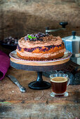 Currant chocolate cake on a cake stand