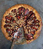 Plum cake with cinnamon and chopped almonds