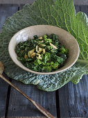 Warm Savoy cabbage-zucchini-broccoli salad with balsamic vinegar