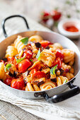 Fusilli with tomato and eggplant in a pan