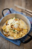 Mushroom risotto with Parmesan in a pan