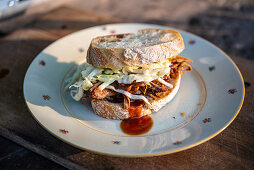 A pulled pork and coleslaw sandwich