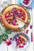 Cheesecake with summer berries, sliced