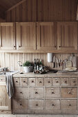 Vintage chest of drawers in open kitchen of chalet