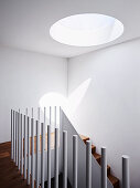 White stairwell with skylight
