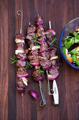 Fillet skewers with a beetroot and apple salad and a macadamia nut vinaigrette