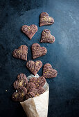Chocolate orange hearts (vegan) falling out of a paper bag