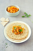 Injera, pancakes made from teff flour with lentil and carrot vegetables (Ethiopia)