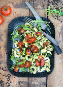 Tortellini with ricotta filling, rocket, spinach and tomatoes