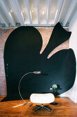 Large art installation of spades symbol on wall and floor