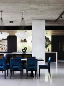 Dining area with designer chairs in an open living room