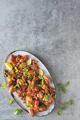 Sherry chicken with coriander leaves and limes