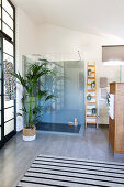 Glass shower cubicle in bathroom