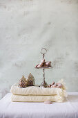 Gingerbread hearts on cakes stand and Oriental lanterns on folded blanket