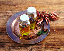 Homemade oriental spice oil in small bottles