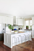 White kitchen in American country style with dark wooden floor