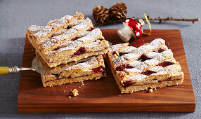 Nutty Christmas shortcrust tarts with raspberry jam