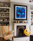 Smiley sign leaning against open fireplace in classic living room