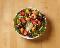 California Salad with Fresh Ingredients on Butcher Block Table shot from above